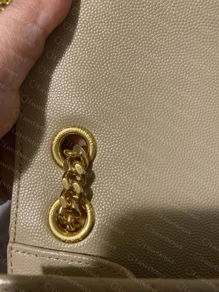 Authentic Saint Laurent Envelope strap ring, "SAINT LAURENT" and "PARIS" both reading correctly and normally around the ring