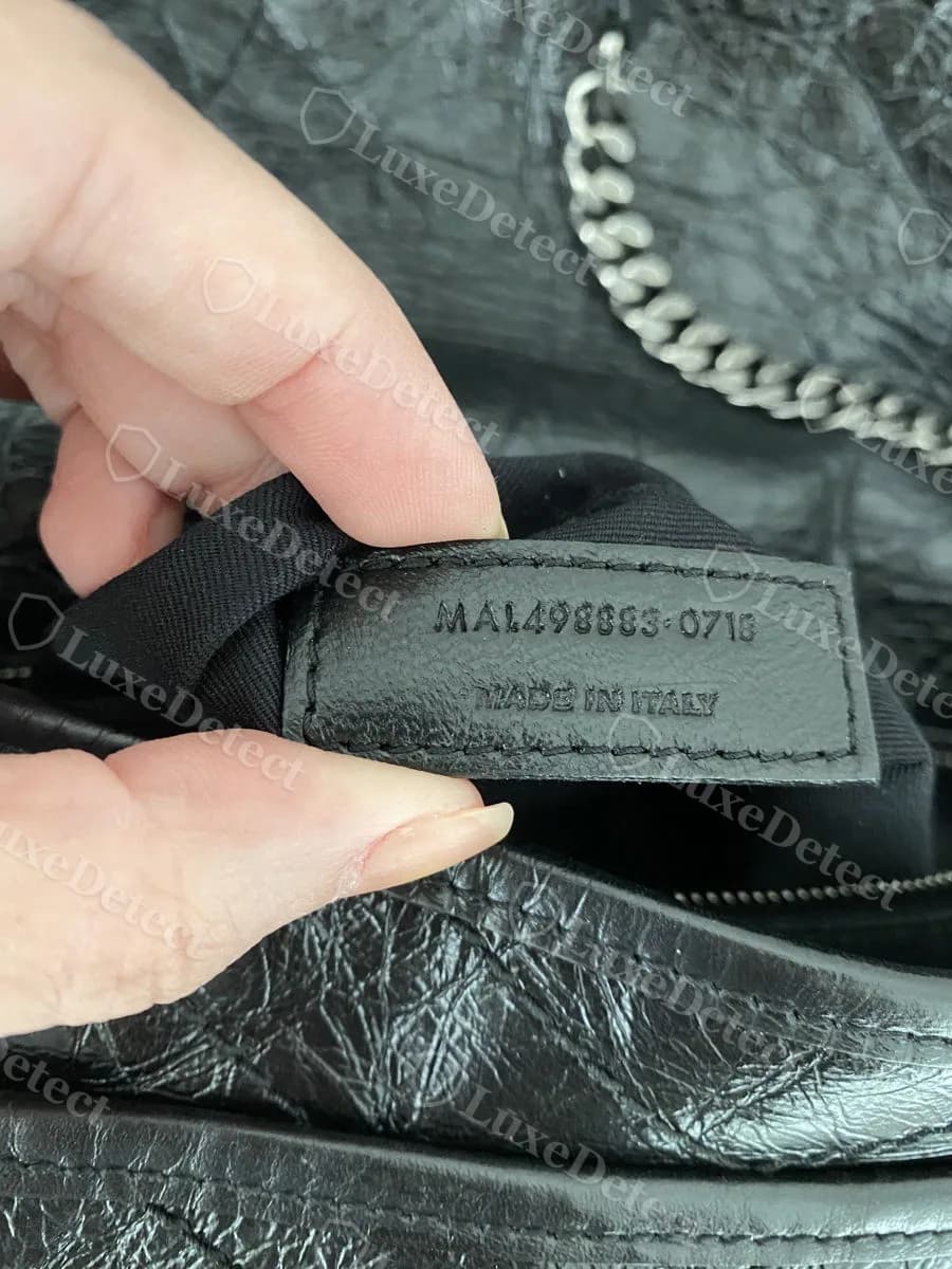 Authentic Saint Laurent Niki date code tab reading "MAL498883-0718" and "MADE IN ITALY," evenly stamped and legible