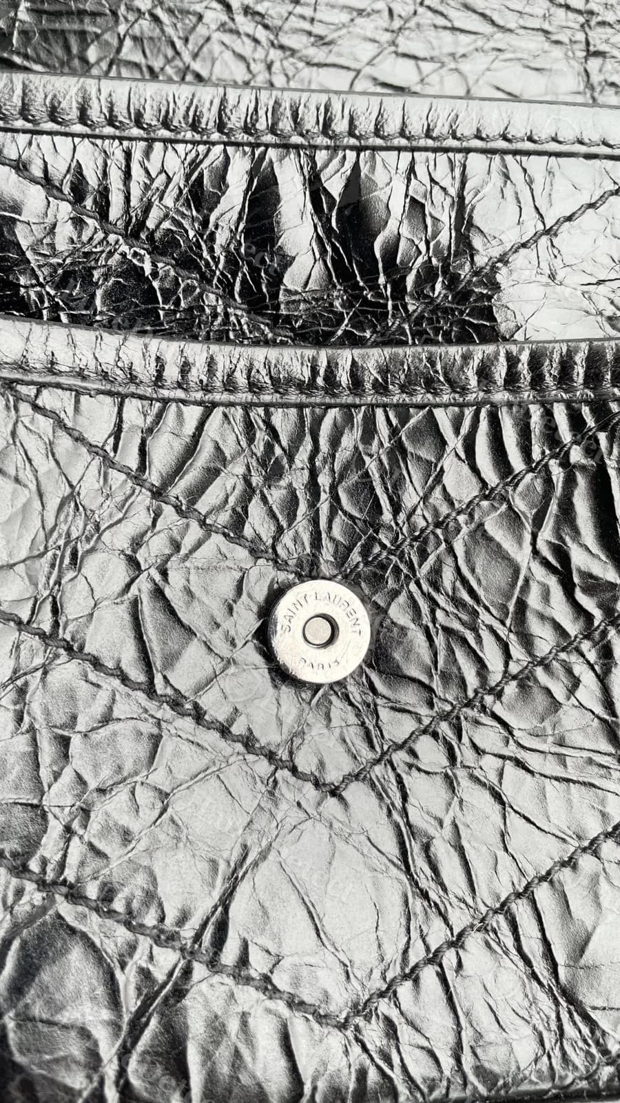 Counterfeit Saint Laurent Niki magnetic snap, also correctly stamped "SAINT LAURENT PARIS" with a clean, even strike