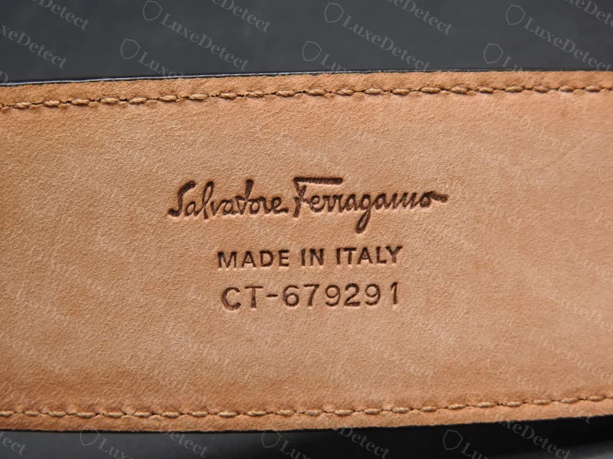 Genuine Ferragamo strap stamp: "Salvatore Ferragamo" script over "MADE IN ITALY" and a style code, pressed cleanly into the tan underside of the strap
