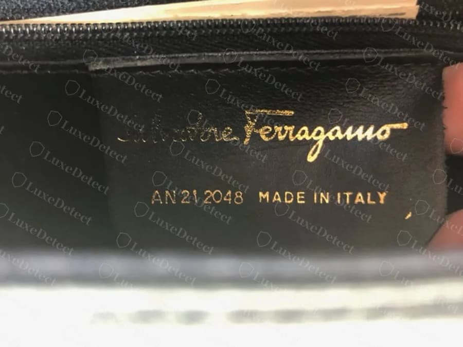 A genuine Ferragamo bag stamp, photographed upside down and turned right way up, reading AN 21 2048 and MADE IN ITALY under the script name