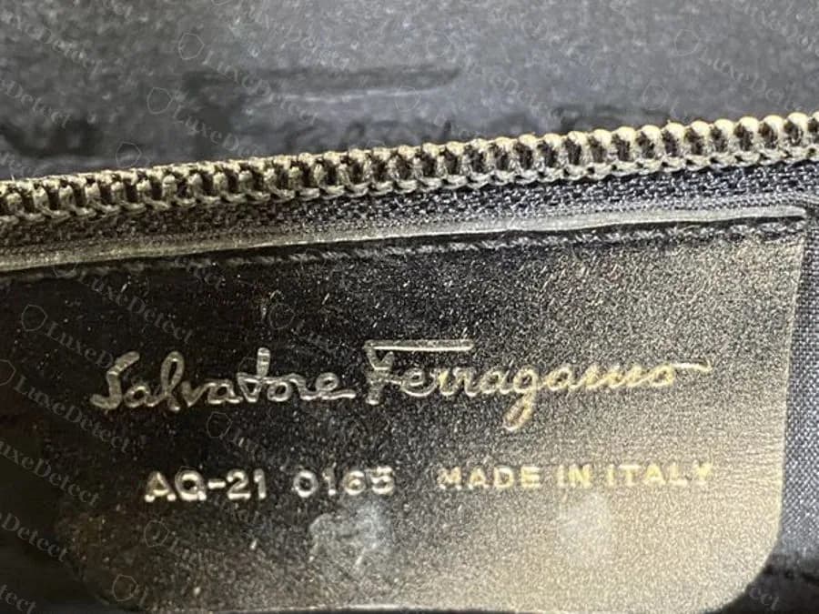 Genuine gold-foil stamp inside a Ferragamo bag pocket: Salvatore Ferragamo, the code AQ-21 0165 and MADE IN ITALY