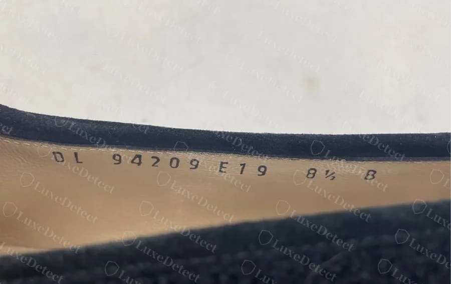 Genuine Ferragamo lining print on a suede loafer reading DL 94709 E19 8½ B: prefix, model, variant, US size and width