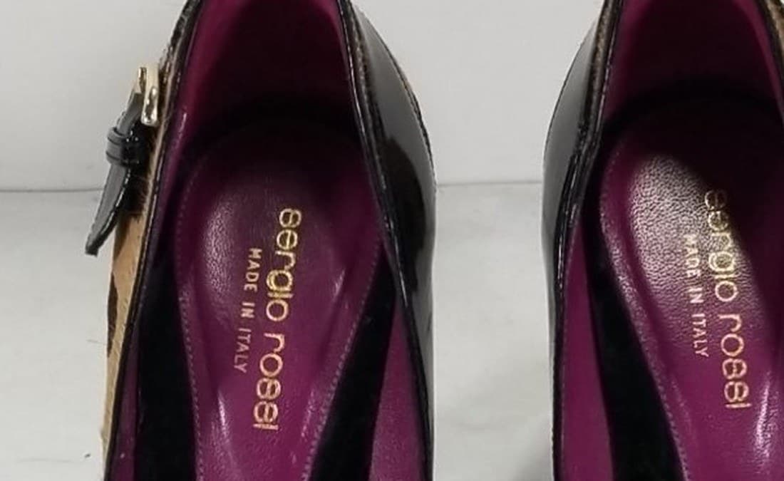 Genuine Sergio Rossi insole stamp — "sergio rossi" in lowercase gold script above "MADE IN ITALY," stamped cleanly into a magenta leather footbed