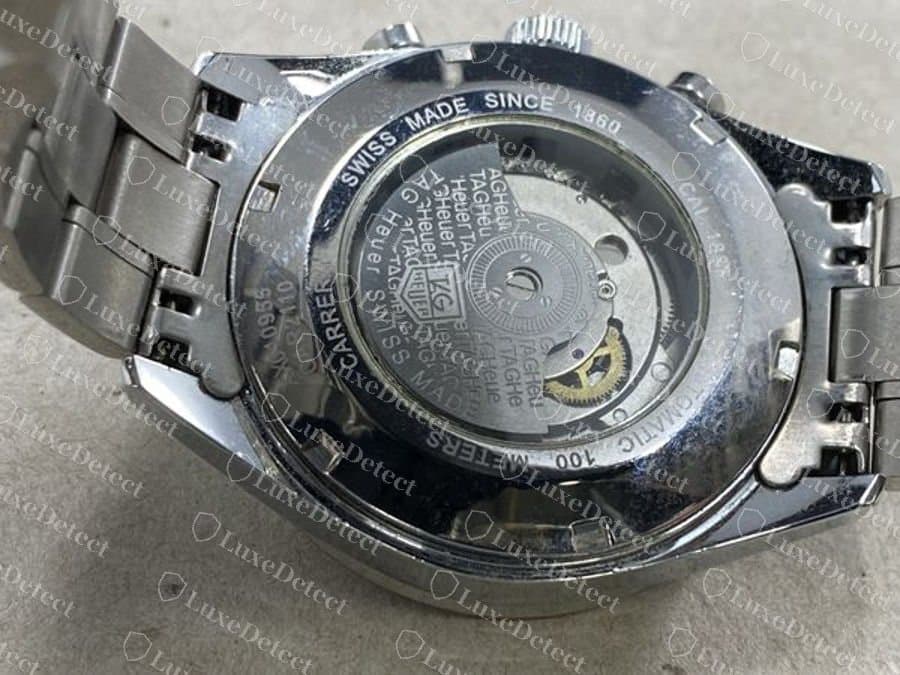 Fake TAG Heuer Carrera display back with a generic movement and printed TAG Heuer lettering instead of a signed rotor