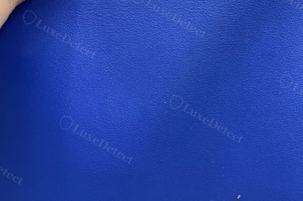 Genuine Telfar vegan leather — even matte-satin grain, low sheen across the panel