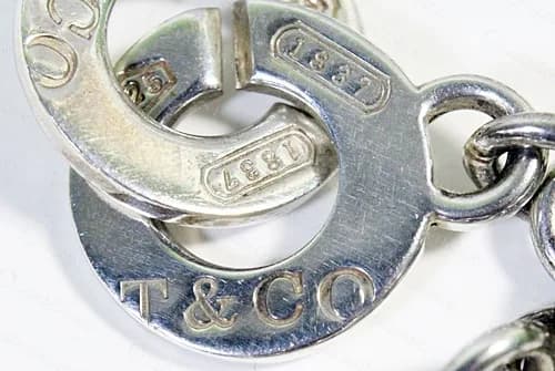 Genuine 1837 interlocking disc links, with T&CO on one disc and 925 and 1837 cartouches on the slit edge of the next.