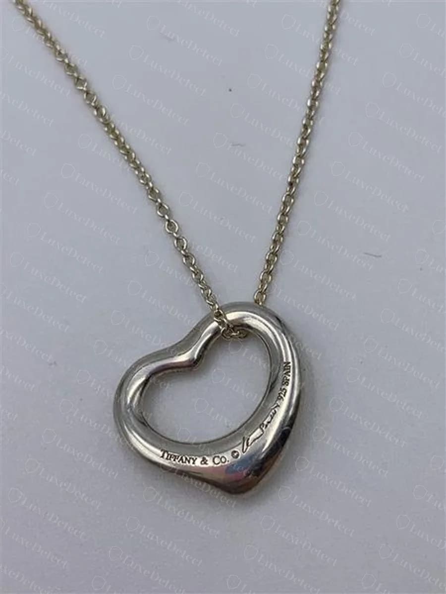 Authentic Elsa Peretti Open Heart necklace, fine cable chain and a modest pendant with the TIFFANY & CO. Peretti 925 SPAIN hallmark on the interior curve
