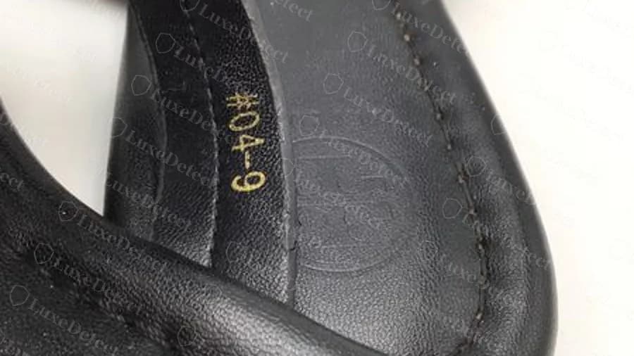 Fake Miller in black leather: gold-foil number string on the strap lining, no Made in line