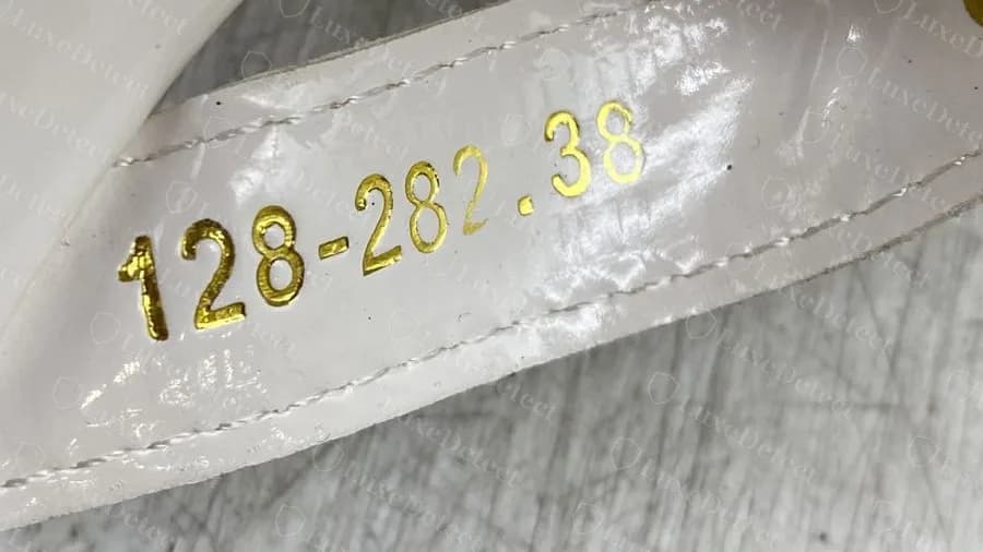 Fake white patent Miller: gold-foil digits on the strap lining, no country and no size