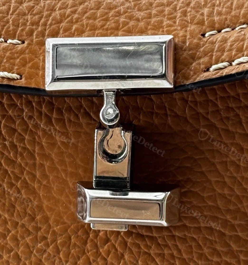Genuine Toteme T-Lock clasp: plain polished silver-tone metal with no text or logo engraved on the crossbar