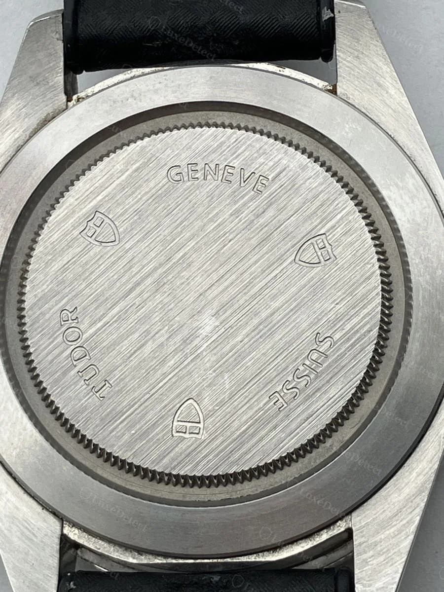 Fake Tudor Grantour Chrono caseback: a flat stamped plaque reading TUDOR, GENEVE, SUISSE with shield logos, on the same example.