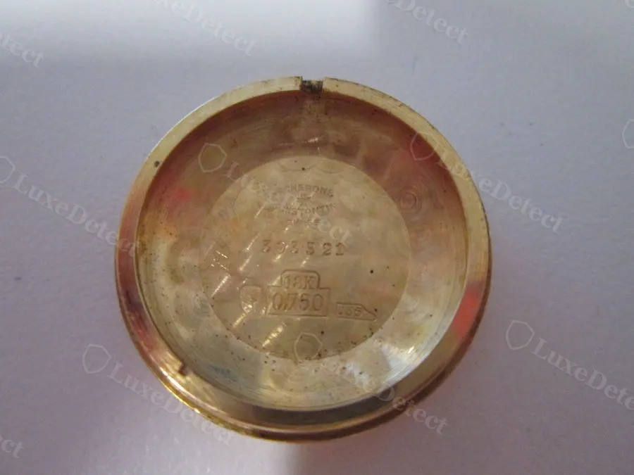 A genuine 18K gold Vacheron & Constantin caseback: struck poinçon hallmark, "0.750" fineness mark, and engraved case reference, all sharply cut.