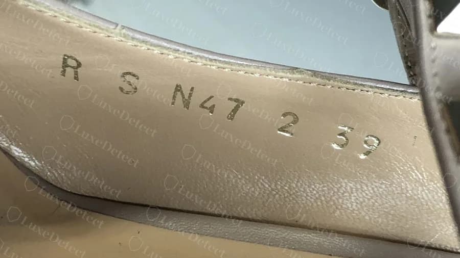 Stamped production code inside a genuine Rockstud pump, letters and numbers followed by the size
