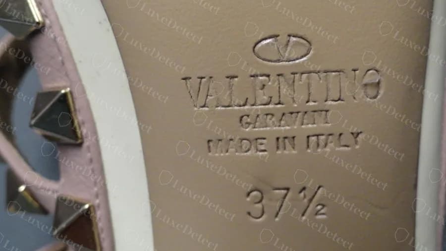 Genuine sole stamp on a cream Rockstud pump, V logo, VALENTINO, GARAVANI, MADE IN ITALY and the size, embossed into the leather sole