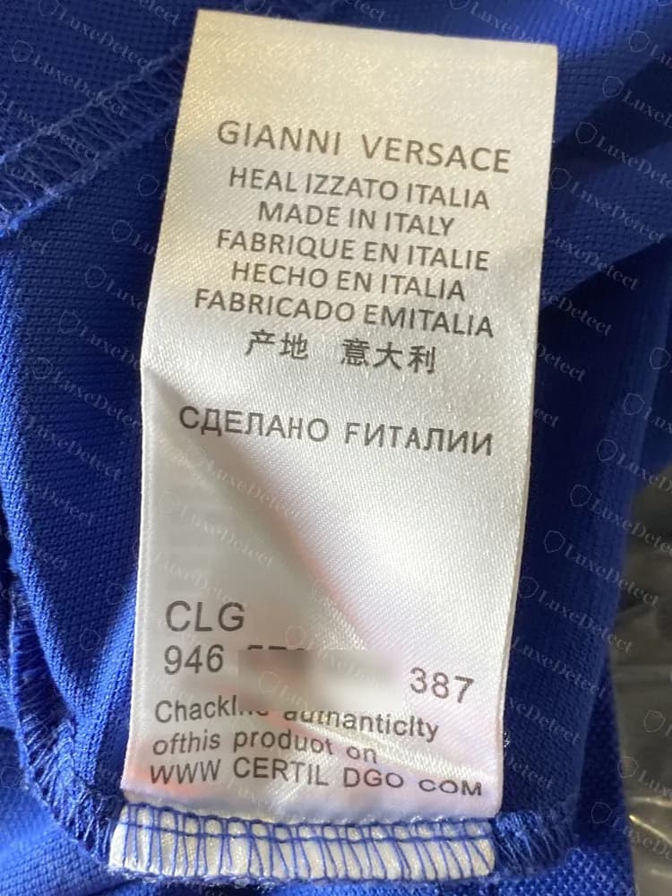 Counterfeit Versace care label: HEAL IZZATO ITALIA, FABRICADO EMITALIA, a misprinted check line and CERTIL DGO, with the middle digits of the CLG code blurred