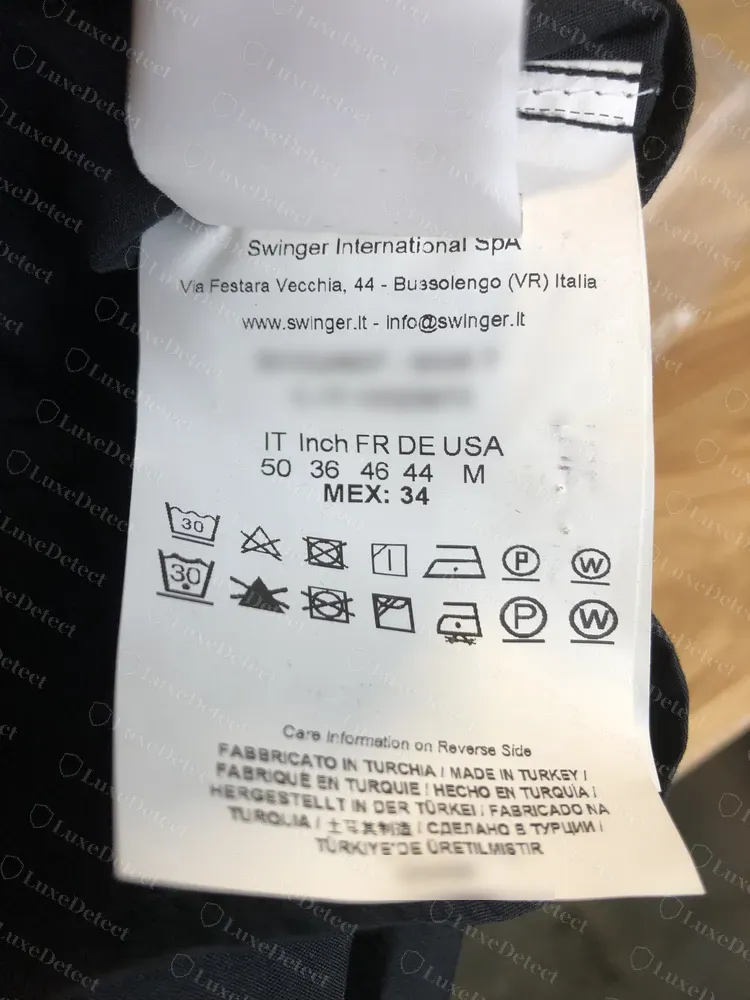 Genuine newer Versace Jeans Couture care label from Swinger International SpA, Bussolengo, with size grid, care symbols and made-in lines