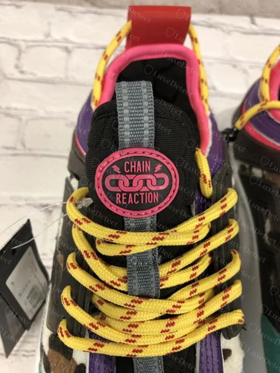 Genuine pair, confirmed authentic: the tongue carries the same "Chain Reaction" patch buyers often mistake for a fake-only detail.