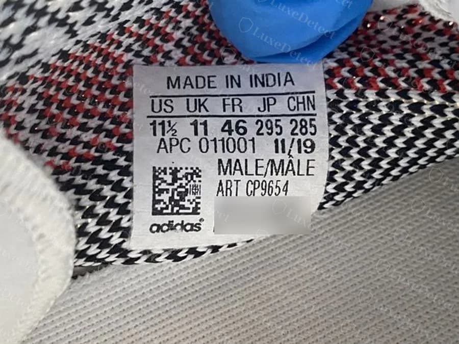 Etiqueta de tamanho original do Zebra de uma produção posterior: MADE IN INDIA com código de fábrica APC 011001 e data 11/19, a mesma ordem de campos e o mesmo número de artigo CP9654; as linhas de série da unidade estão borradas