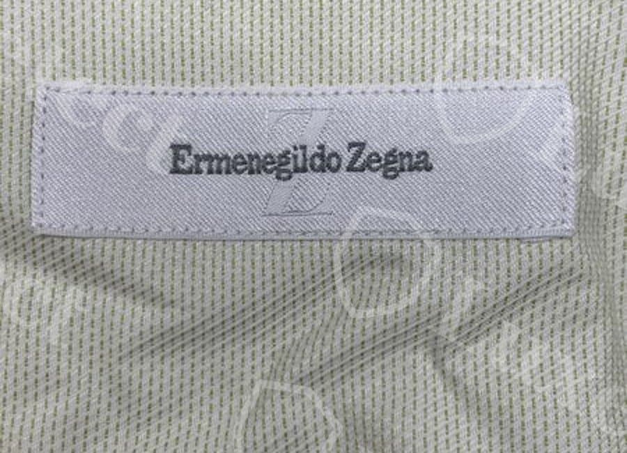 Confirmed fake Zegna dress shirt back-neck label — a similarly plain "Ermenegildo Zegna" wordmark; label wording alone did not distinguish this fake from genuine examples